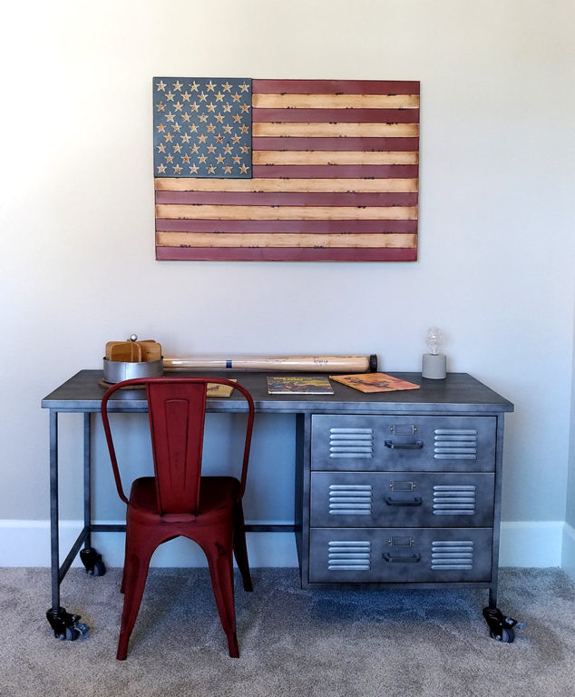 American flag wall art and industrial metal desk