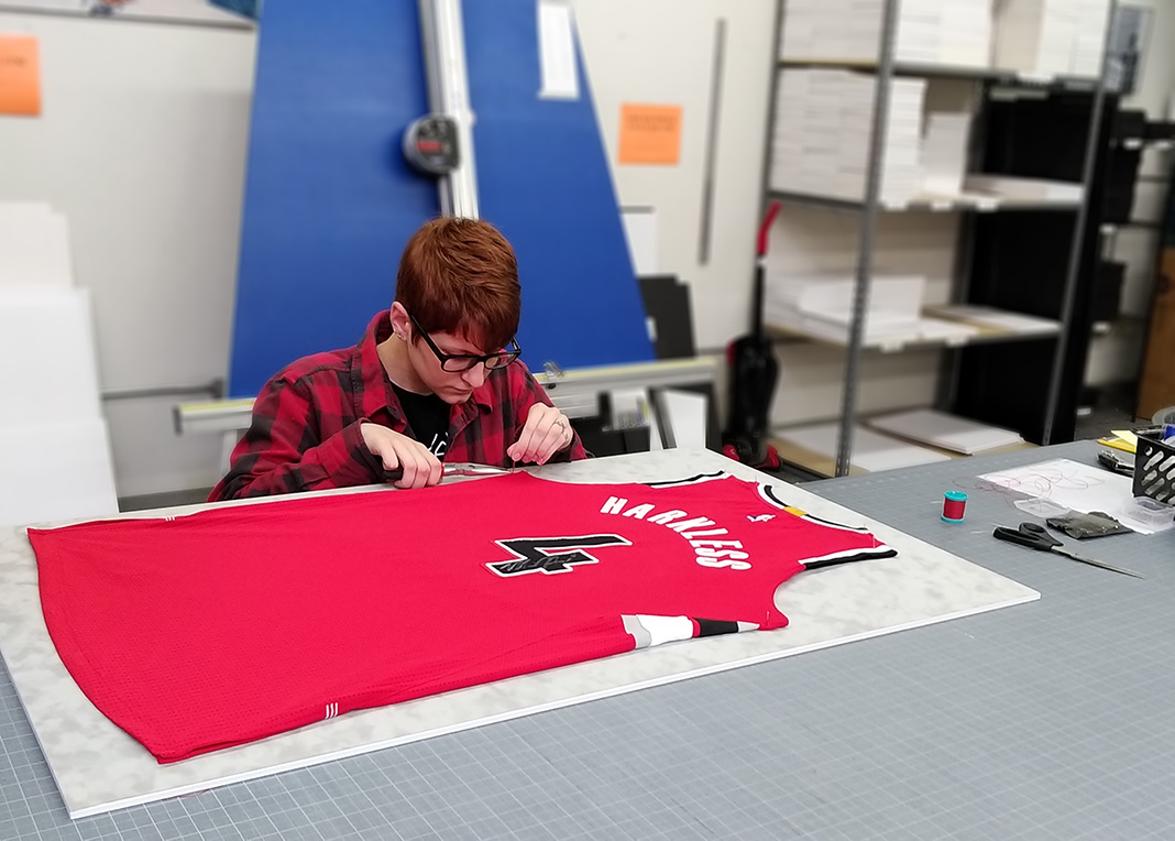Sewing down a sports jersey