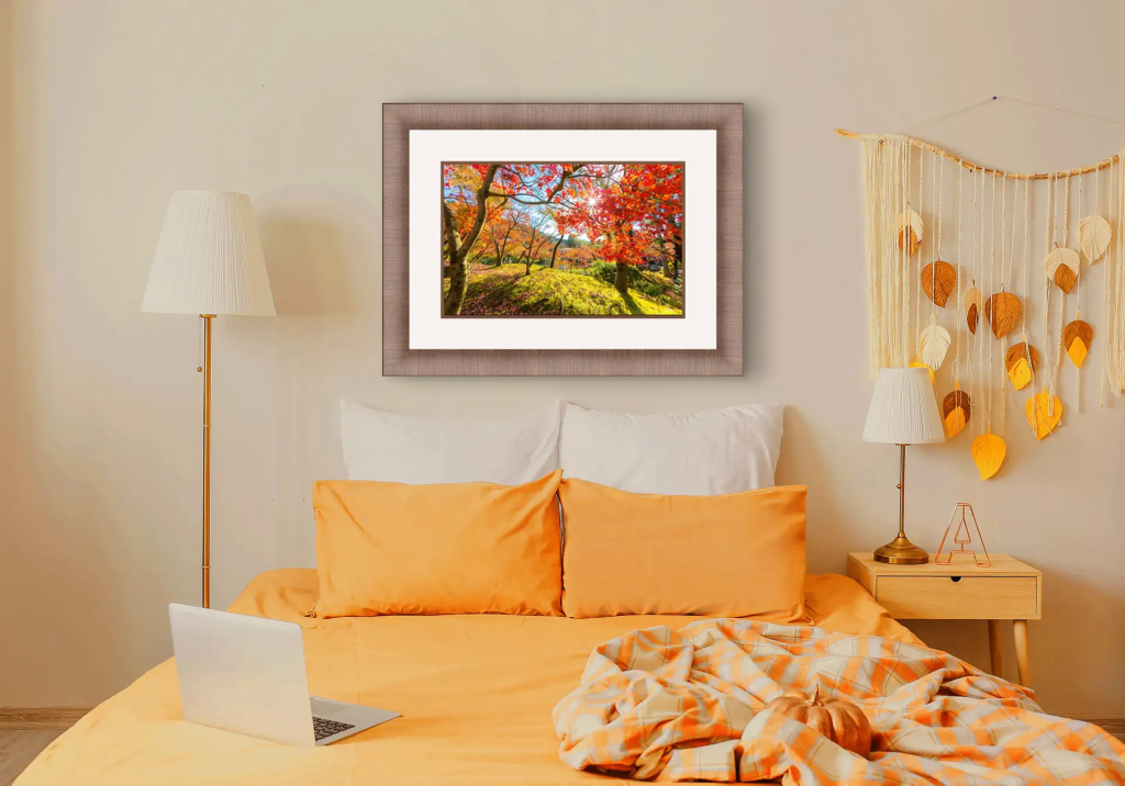 A custom picture framing display featuring natural wood frame designs.
